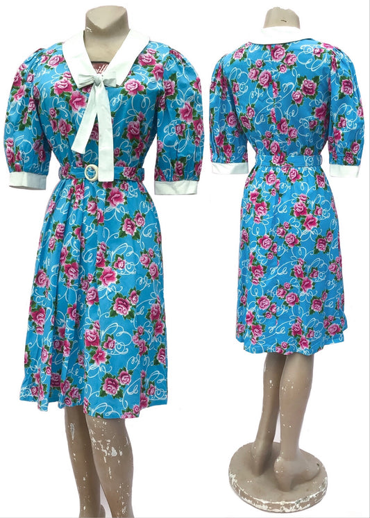 Vintage 80s summer cotton dress, turquoise with pink carnations print. White collar and cuffs with white bow tie