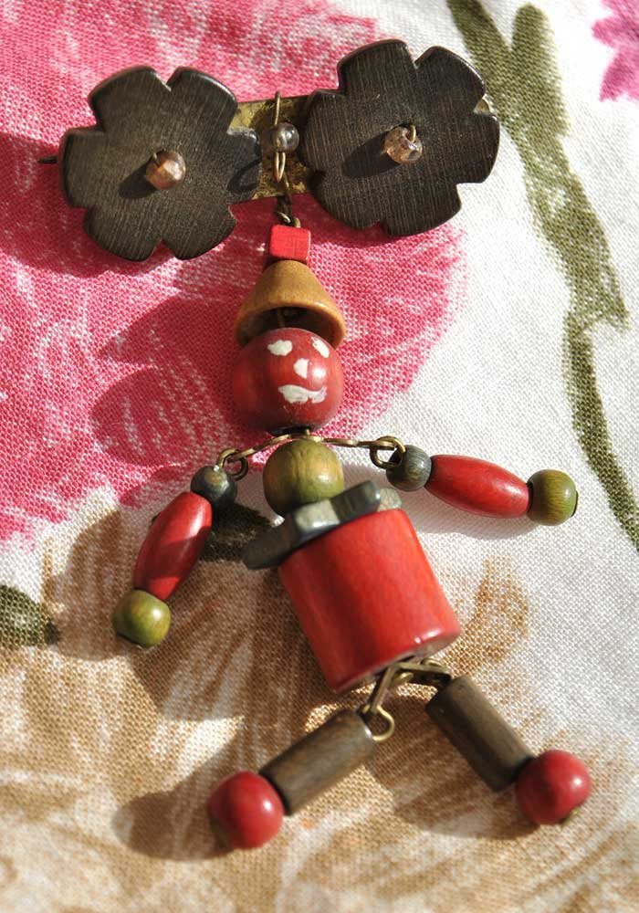 1940s wood bead articulated man brooch, Haskell era.