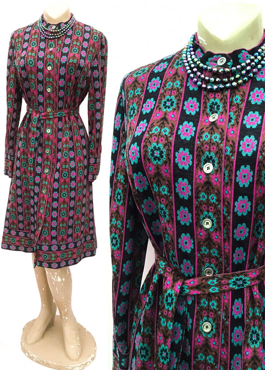 Fab 70s courtelle knit dress, button down front with a pinky, red and black floral striped print, belt tie waist and long sleeves. Perfect vintage Autumn Day dress.