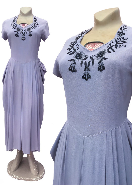 beautiful lilac crepe cocktail dress from the 1940s with black beading on the sweetheart neckline and short sleeves
