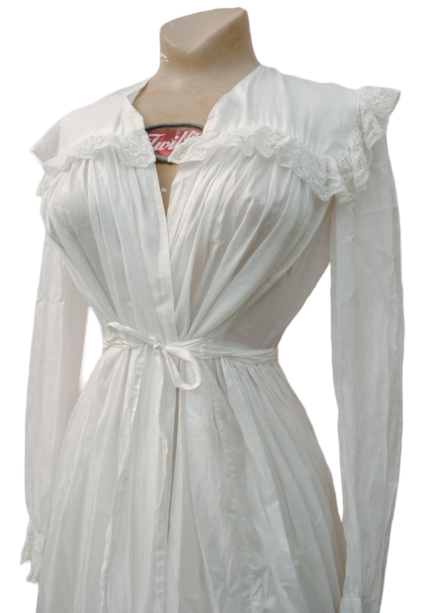 white lace trim decorating the collar yolk