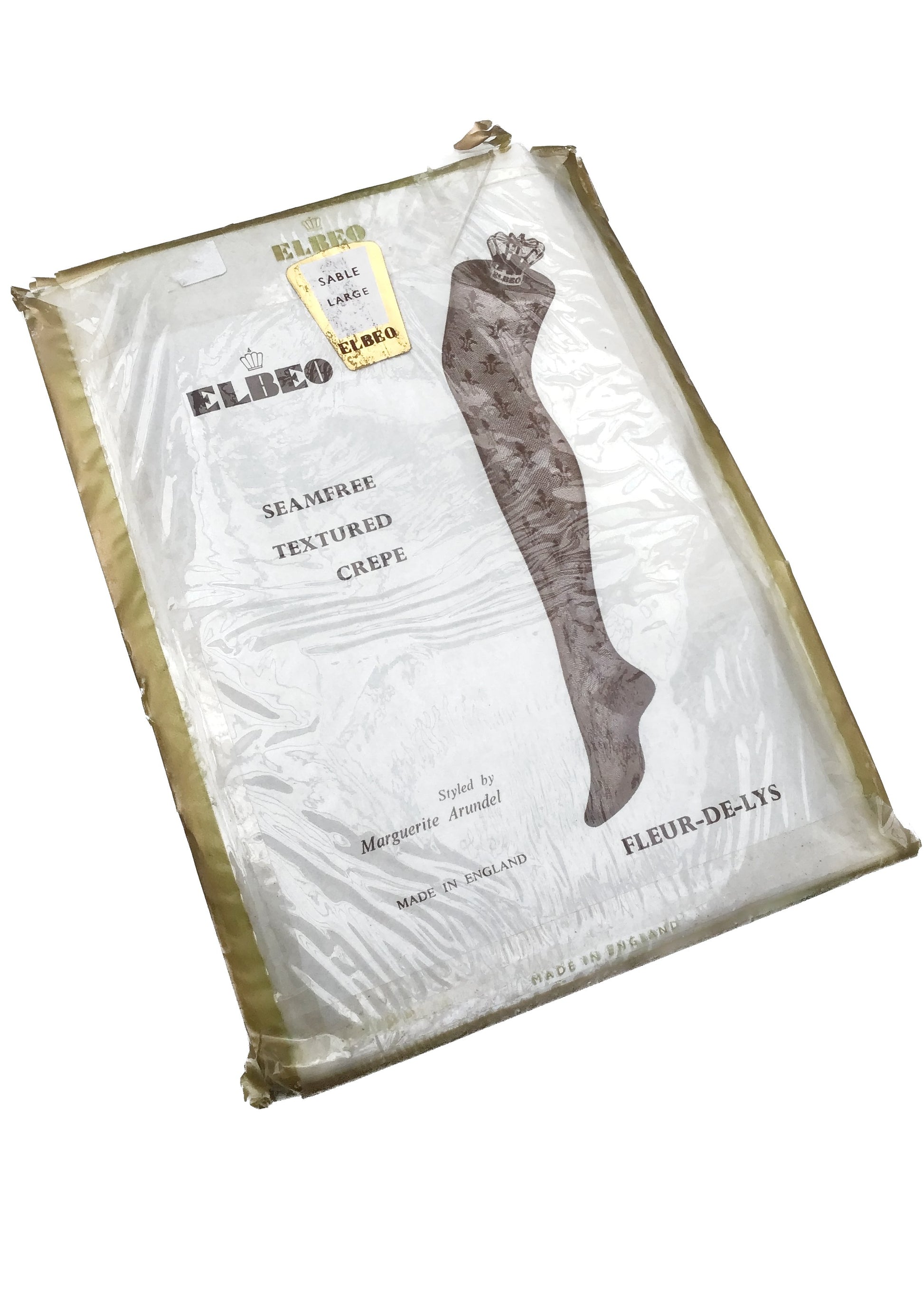 vintage elbeo seam free stockings in a textured fleur de lys lace pattern, sable colour, deadstock packaging unworn