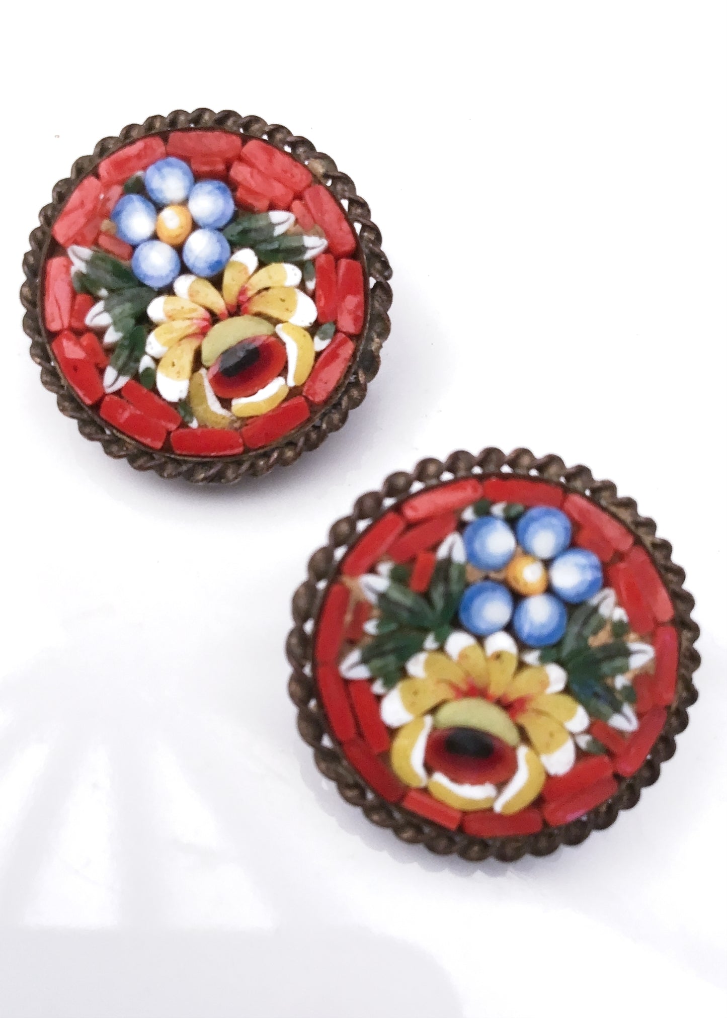 milifiore antique micro mosaic clip on earrings with coloured glass tiles featuring flowers on a red background