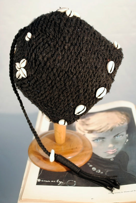 authentic African black hand made wool hat with fly tassel and decorated with cowrie shell beads