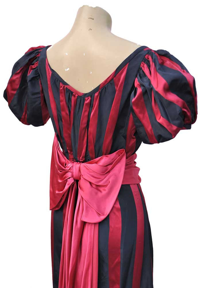 puffed balloon statement sleeves with a fuscia pink bow and swags