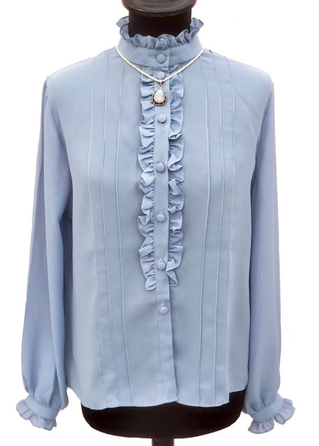 pale dusky blue ruffle blouse with piecrust collar, covered buttons and a frill front