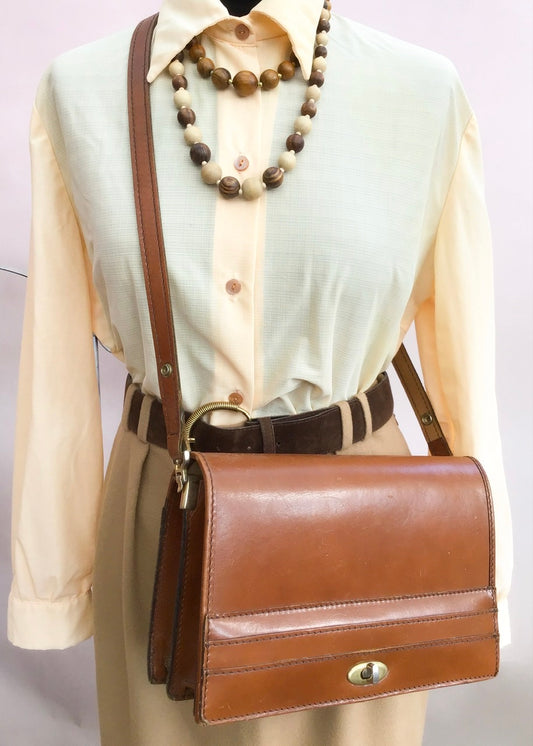 vintage tan leather crossbody shoulder bag satchel from the 1970s