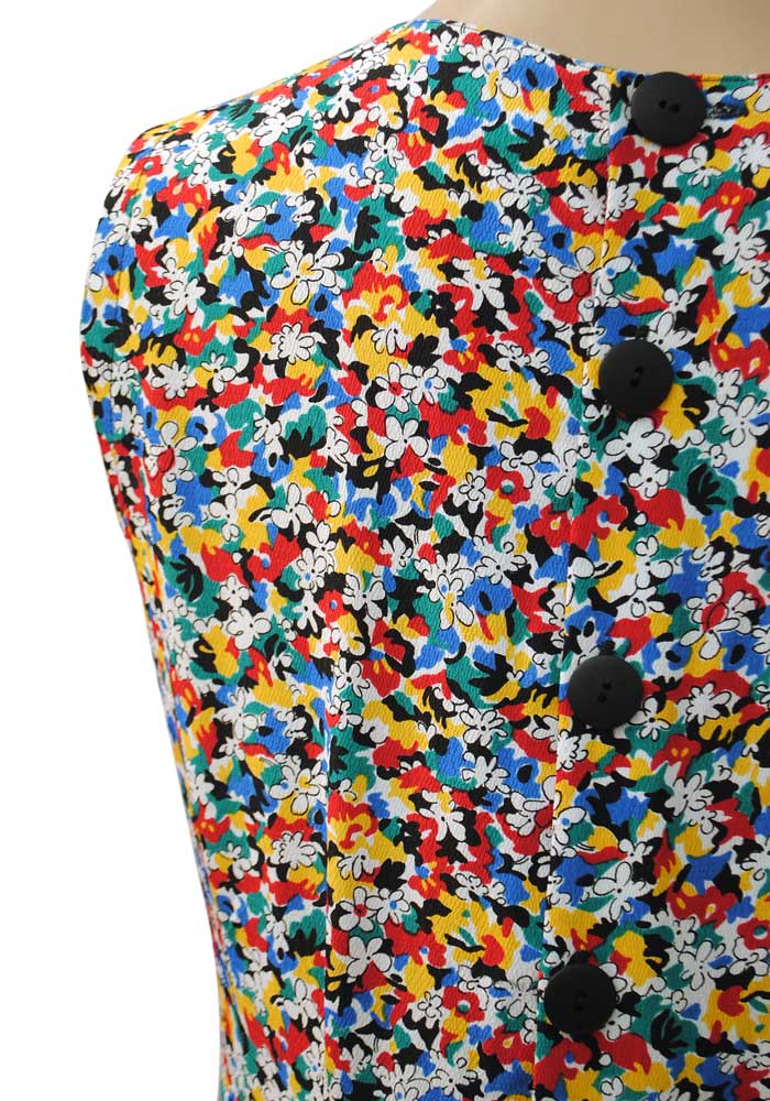 back button dress with colourful floral print of blue, yellow, red and green