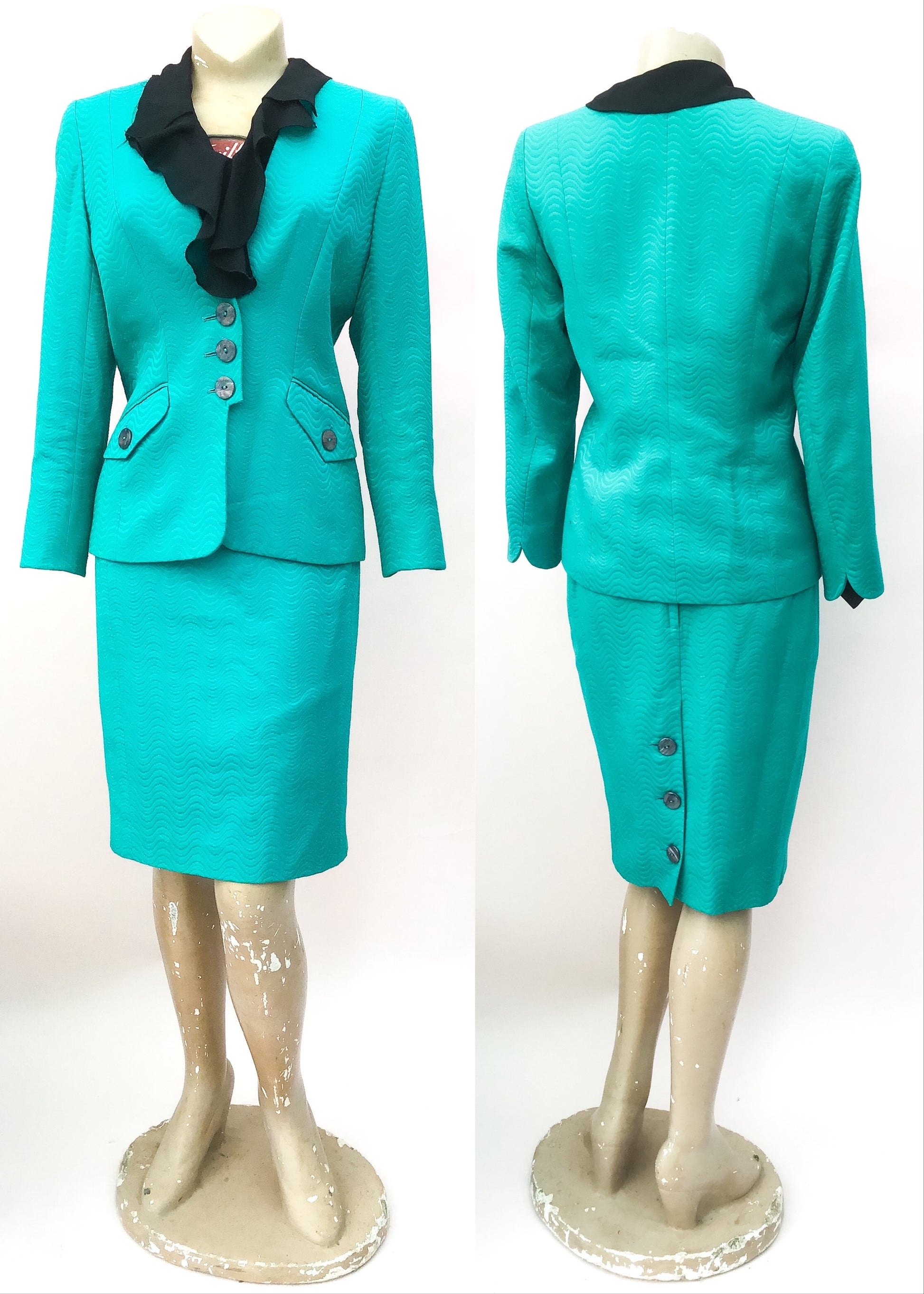 Favoured by british royalty, designer caroline charles turquoise skirt suit.