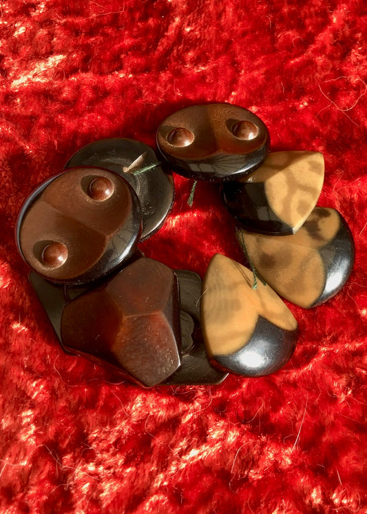 nine vintage midcentury brown bakelite buttons, three sets of three different designs, two of which resemble stylised owl faces, these are so lovely they could be used for jewellery.