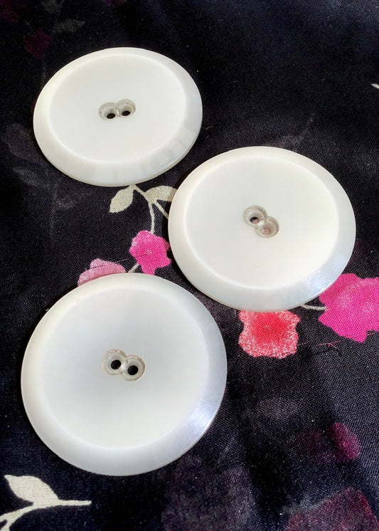 a set of 3 pearlescent white plastic massive vintage buttons, would look great on a vintage coat