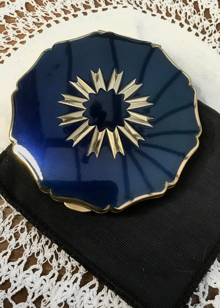 beautiful gift ideas for women with vintage collectible powder compact cases, this one has a lovely deep blue and silver polished front.