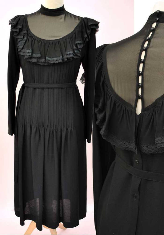 Chiffon sheer black 1970s cocktail dress with deep frill and illusion neckline, buttons down the back
